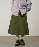 Model wearing Gramicci Nylon Utility Skirt Olive lightweight water-resistant utility skirt