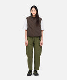 Model wearing Women's Gramicci Voyager Pant Olive with relaxed tapered fit and eco cotton washed twill