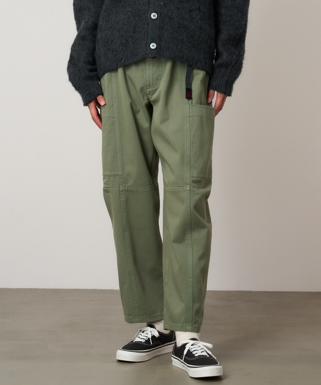 Three-quarter view of model wearing Women's Gramicci Voyager Pant Sage in 100% eco cotton washed twill